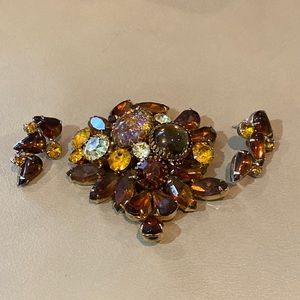 Great fall color rhinestone brooch w “married” earrings. No maker’s mark.